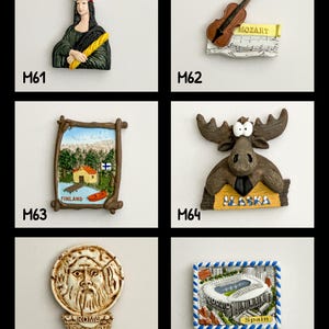May include: A collection of souvenir fridge magnets. The magnets include a depiction of the Mona Lisa wearing a French chef's hat, a violin with Mozart's name, a Finnish landscape, a moose with "Alaska" text, a Roman face, and a Spanish stadium.