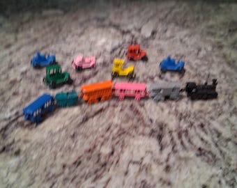 Vintage miniature die-cast metal toy train cars and vehicles