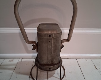 May include: A vintage metal lantern with a handle and a round base. The lantern is painted white and has a weathered look.