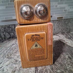 Vintage Jim Beam whiskey decanter shaped like an old-fashioned telephone.