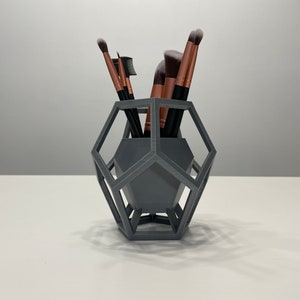Modern, geometric makeup brush holder