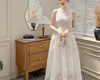 white engagement dress with bow Engagement Party Dress Guide for the Bride-to-Be vs. Guests