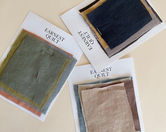 May include: Three fabric swatches with the text "Earnest Quilt" printed on each. The swatches are in shades of green, brown, and beige.