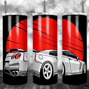 May include: A white sports car with red taillights is partially visible against a red and black background. The car is a side view and the background is a stylized sun.