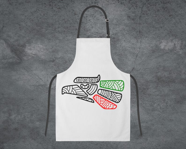 May include: White apron with a black and green stylized eagle design. The eagle is outlined in black and filled with green, red, and white colors.
