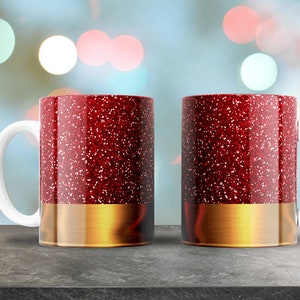 May include: Two red glitter mugs with gold rims. The mugs are on a gray surface with a blurred background of colorful lights.
