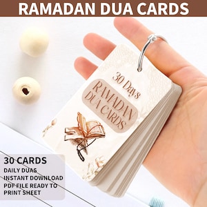 May include: A set of 30 printable Ramadan Dua cards with a beige background and a brown illustration of a prayer rug, open book, and prayer beads. The text on the cards reads "30 Days Ramadan Dua Cards".