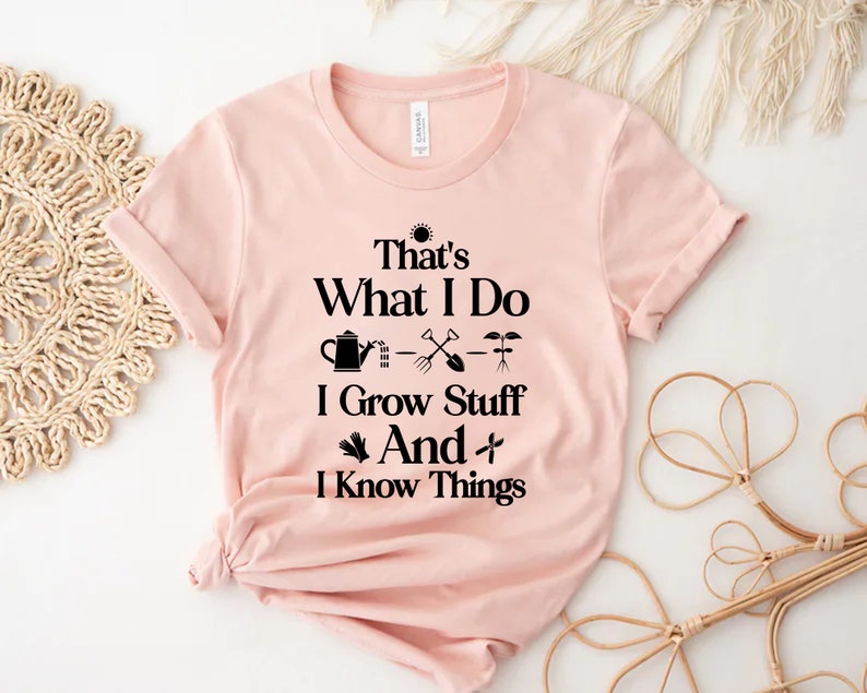 May include: A pink t-shirt with a black graphic that says "That's What I Do - I Grow Stuff And I Know Things" with gardening icons.