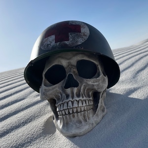 1:1 Skull with small plastic M1 helmet painted to look like metal WW2 style