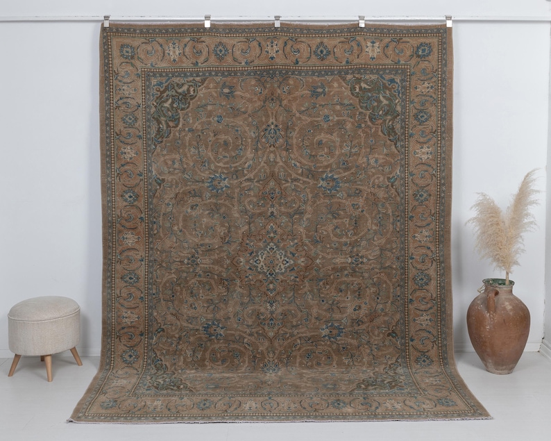 7.5 x 9.9 feet vintage persian rug, Warm brown background with muted blue floral and medallion details.