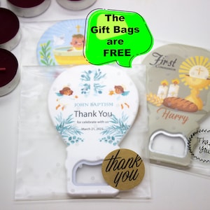 May include: Two white and brown bottle openers with a religious theme. One features a baptism scene with the text "John Baptism" and "Thank You". The other features a communion scene with the text "First Communion" and "Harry". Both have a brown circle sticker with the text "Thank you".