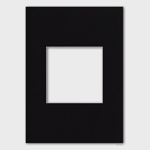 May include: Black mat board with a white window opening. The mat board is designed to be used for framing artwork or photographs.
