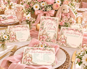 May include: A set of baby shower stationery featuring a pink and cream floral design with a bunny illustration. The cards include text such as Baby in Bloom, Wishes for Baby, Advice for Mommy, and Baby Predictions & Wishes, all accented with pink bows.