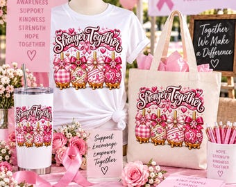 May include: A white t-shirt, a canvas tote bag, and a stainless steel tumbler, all featuring a graphic of four pink candy apples and the text Stronger Together. Includes a sign with inspirational words, a pink ribbon, and a pen holder.
