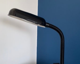 Desk lamp with “shiny” storage base