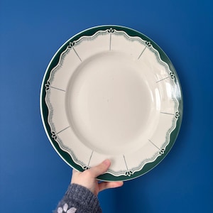 May include: A weathered wooden sign, inscribed with 'Welcome to our home' in white. The sign has a distressed appearance, suggesting a vintage aesthetic, and is suitable for a porch or hallway.