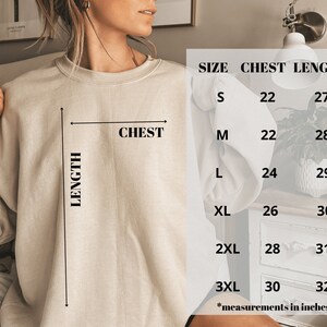 May include: Size chart for a sweatshirt with measurements in inches for chest and length. Sizes include S, M, L, XL, 2XL, and 3XL.