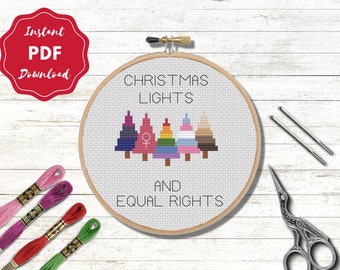 May include: Cross stitch pattern featuring five Christmas trees with different pride flags, with the text "Christmas Lights and Equal Rights".