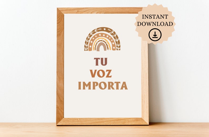 May include: A printable wall art print with a rainbow design and the text "TU VOZ IMPORTA" in brown lettering. The rainbow is made up of different shades of brown and has a floral design around it.