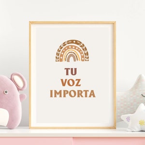May include: A framed print with a brown and orange rainbow design and the text "TU VOZ IMPORTA" in brown lettering.