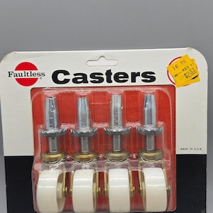 May include: Four Faultless casters with white wheels, metal stems, and brass accents, packaged in a red and white blister pack. The package includes the text "Casters", "Ball Bearing", and "Easy Rolling". The wheels are 1.25 inches.