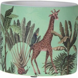 May include: A green ceramic planter featuring a giraffe, a bird, and tropical plants. The giraffe is brown with a spotted pattern and is standing in a jungle setting.