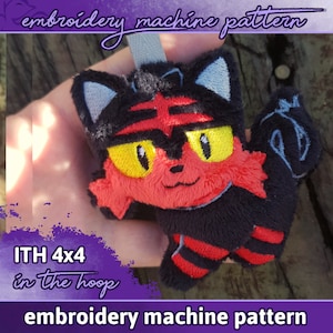 May include: Embroidered plush toy of a red and black Pokemon character with yellow eyes. The toy is 4x4 inches and is designed for use with an embroidery machine. The text "ITH 4x4 in the hoop" is visible in the image.