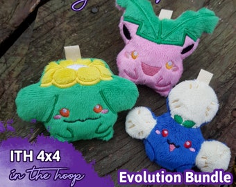 May include: Three plush toys in the shape of Pokemon characters. The toys are green, pink, and blue. The toys are sitting on a wooden surface. The text "ITH 4x4 in the hoop" and "Evolution Bundle" are visible in the image.  embroidery machine pattern