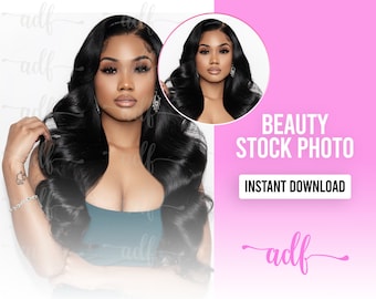 May include: A woman with long, black, wavy hair and dark makeup is looking at the camera. She is wearing a teal tank top and a silver bracelet. The background is white.