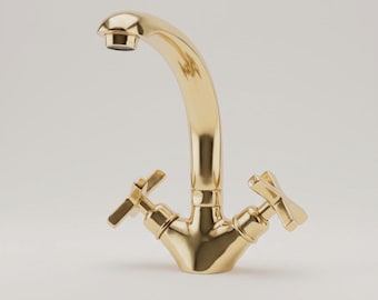 Puede incluir: Un grifo de metal en tono dorado pulido con un caño de arco alto y dos manijas en forma de cruz. El accesorio tiene un acabado liso y reflectante con un aireador estándar en la punta del caño, diseñado para su instalación en un lavabo.