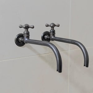 Messing kraan voor wandmontage: buitenwandkranen, zwarte afwerking.