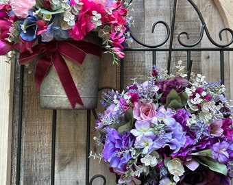 These beautiful Floral Hanging Cans are Perfect for your Front Door.  They can also Hang Indoors or Even Sit on a Shelf.