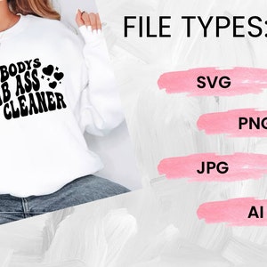 May include: A white sweatshirt with the text "Somebody's Bomb Ass House Cleaner" in black lettering with hearts. The text is in a retro font. The image also shows the file types available for download: SVG, PNG, JPG, and AI.