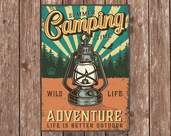 May include: Vintage style camping poster featuring a lantern in the centre. The poster has a red, orange and green colour scheme with the text "Summer Camping Time" at the top and "Adventure Life is Better Outdoor" at the bottom.