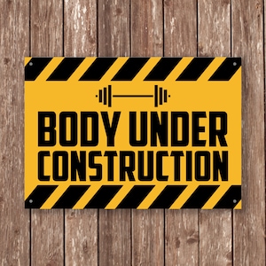 May include: Yellow and black construction sign with the text "BODY UNDER CONSTRUCTION" and a black and white dumbbell icon.