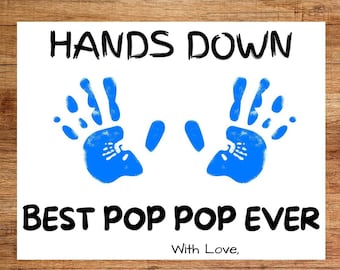 May include: Printable sign with blue handprints that reads "Hands Down Best Pop Pop Ever" with the words "With Love" underneath.