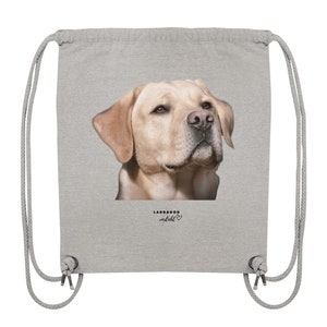 May include: A gray drawstring bag with a picture of a golden labrador retriever on the front. The text "LABRADOR verliebt" is printed below the image.