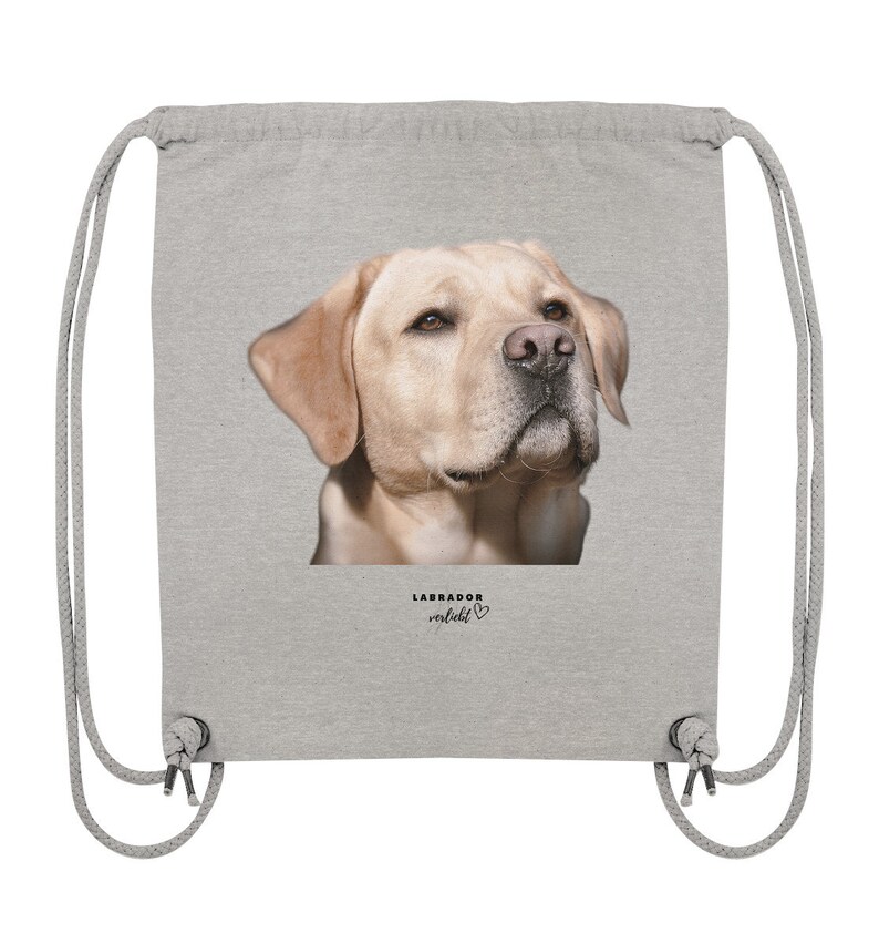 May include: A gray drawstring bag with a picture of a golden labrador retriever on the front. The text "LABRADOR verliebt" is printed below the image.