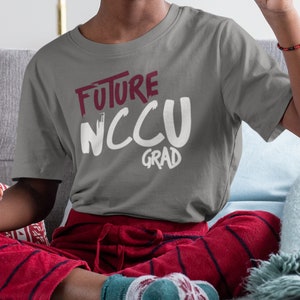 May include: A gray t-shirt with white text that reads "Future NCCU Grad".