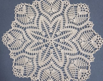 Handmade creamy lace crochet doily.