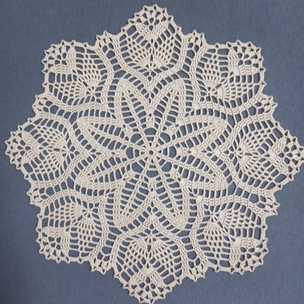 Handmade creamy lace crochet doily.