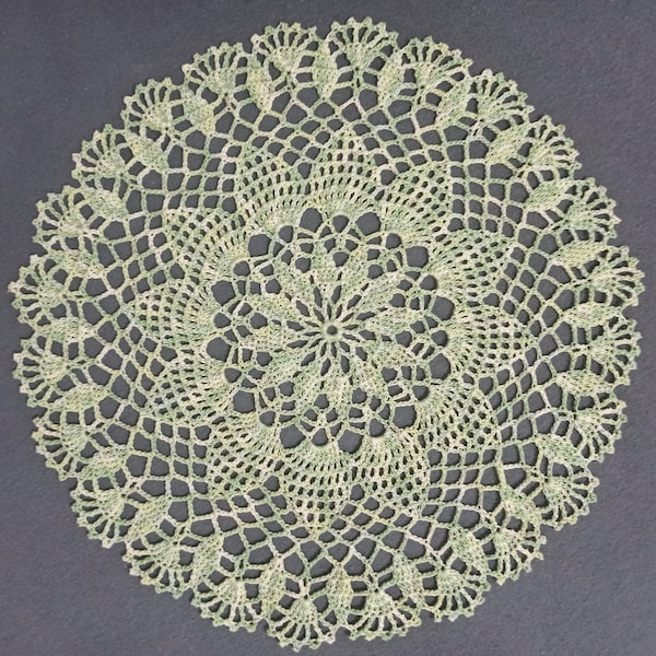 Handmade light green lace crochet doily.