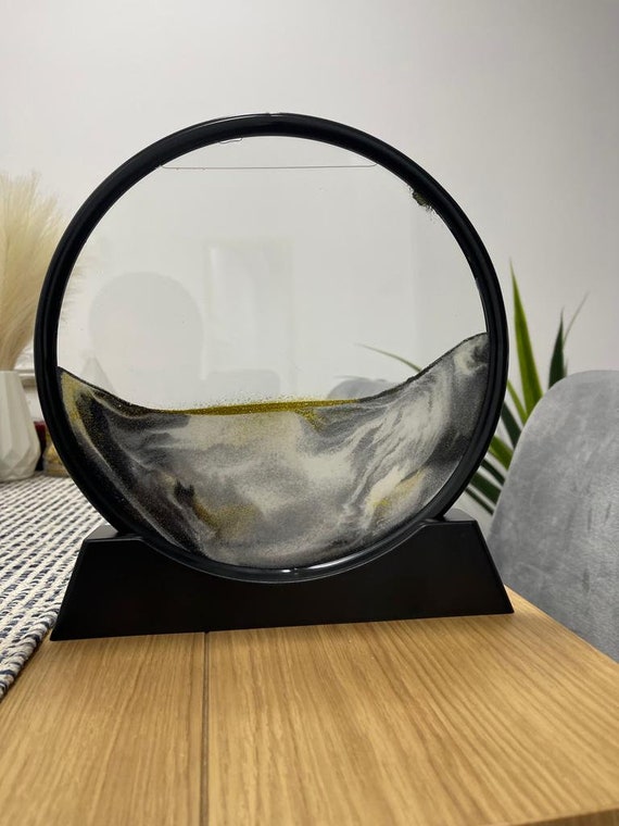 A handmade round deep-moon hourglass with 3D liquid motion — the "moon" theme and round glass format genuinely elevate it above standard sandscape frames.