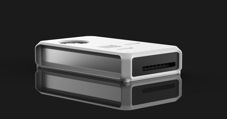 May include: A white rectangular electronic device with a black vent and a circular opening on top. The device has a reflective surface below it, creating a mirrored effect. The background is black.