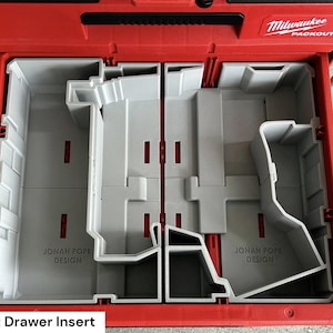 May include: Red Milwaukee Packout drawer with a gray insert. The insert is divided into multiple compartments and features the text "JONAH POPE DESIGN". The Packout drawer is designed for tool organization.