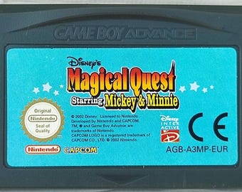 May include: A Game Boy Advance cartridge for Disney's Magical Quest, starring Mickey & Minnie. The cartridge has a teal label with the game title in orange and yellow, and the Nintendo seal of quality.