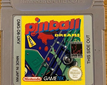 May include: A gray Nintendo Game Boy cartridge labeled "Pinball Dreams." The game's label features a colorful pinball machine graphic with the text "Pinball Dreams." The cartridge also has the Nintendo and GameTek logos.