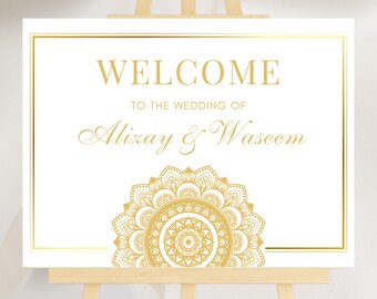 May include: White wedding welcome sign with gold trim and a gold mandala design. The text reads "Welcome to the wedding of Alixay & Waseem".