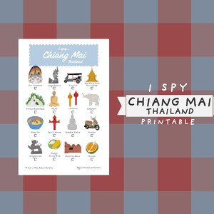 May include: A colorful printable titled "I Spy Chiang Mai Thailand." The print features illustrations of various landmarks and cultural symbols, including temples, a tuk-tuk, and an elephant, with the text "Chiang Mai" at the top.