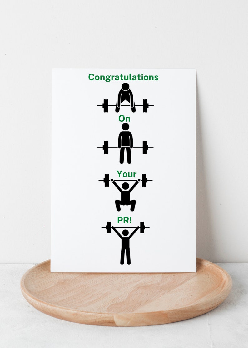 May include: Congratulations on your PR! A motivational card with a stick figure lifting weights, with the text "Congratulations on your PR!" in green.